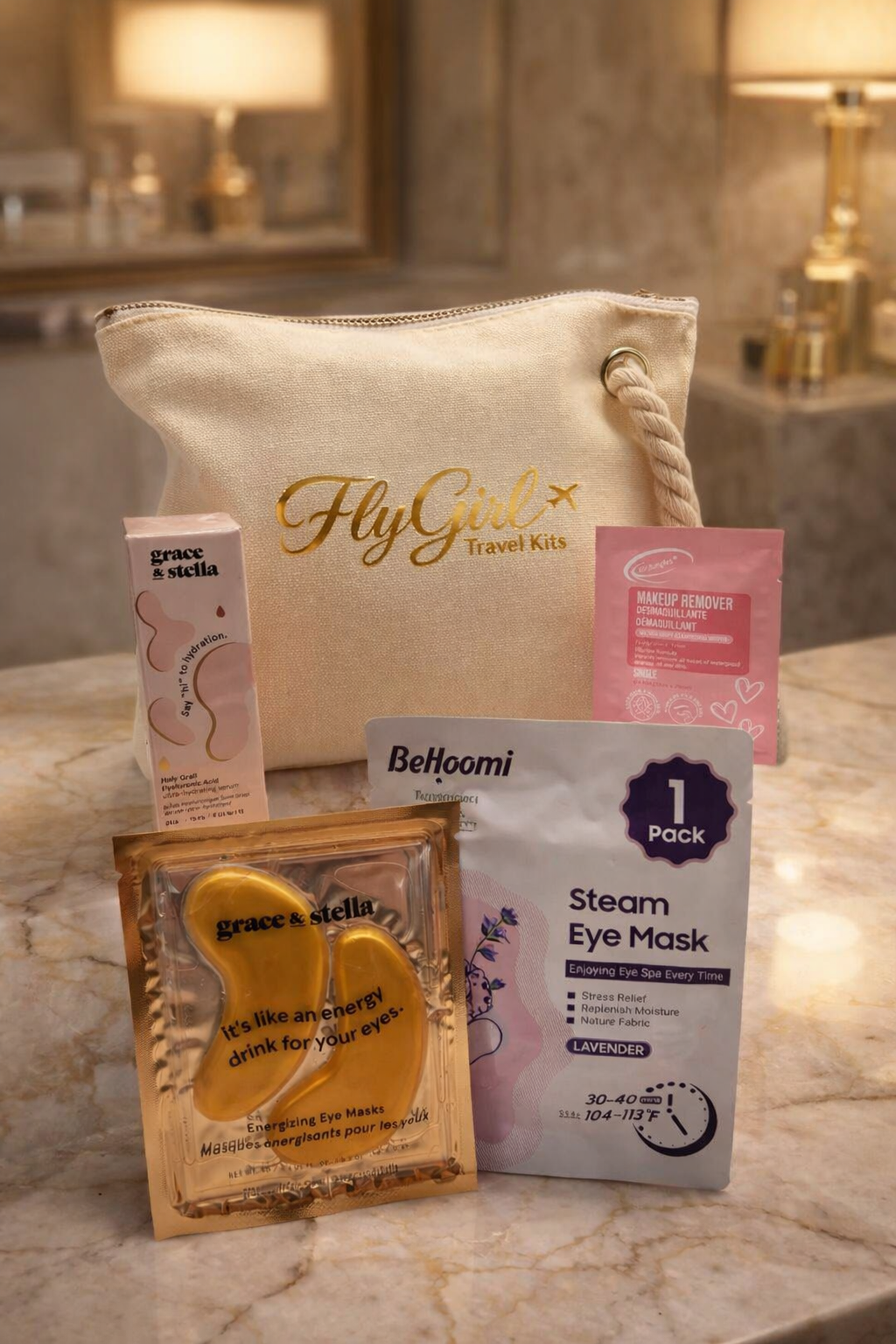 Glow on the Go elevated travel skincare kit displayed on marble hotel vanity