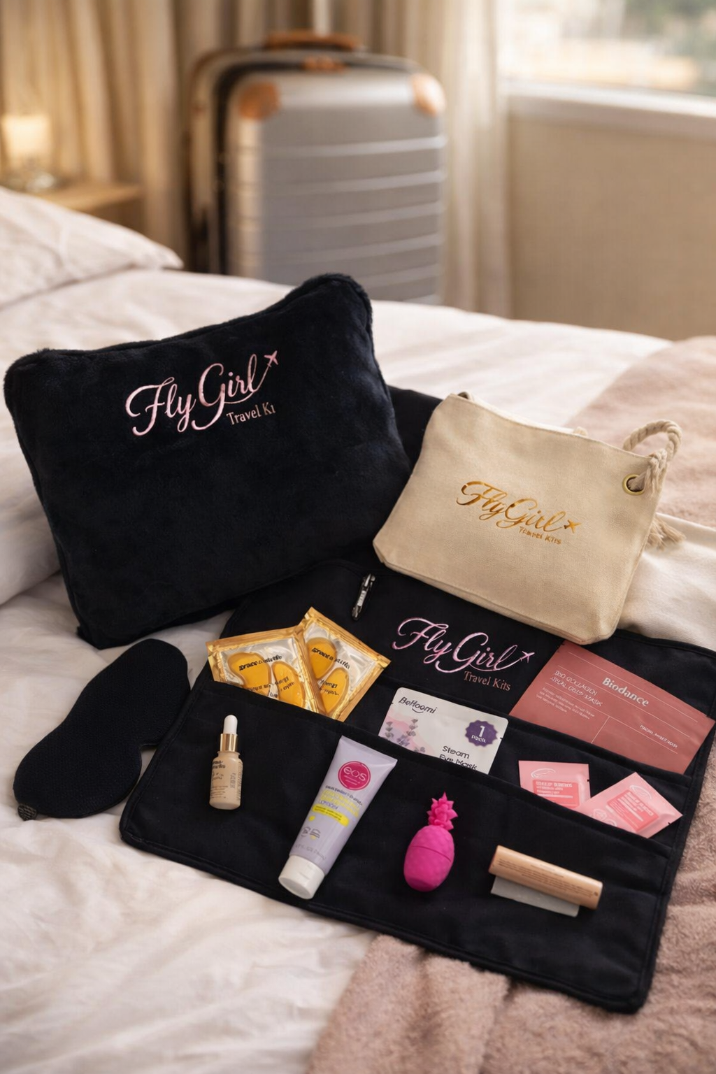 Elevated travel wellness kit with FlyGirl pouch, sleep mask, eye masks, and skincare essential