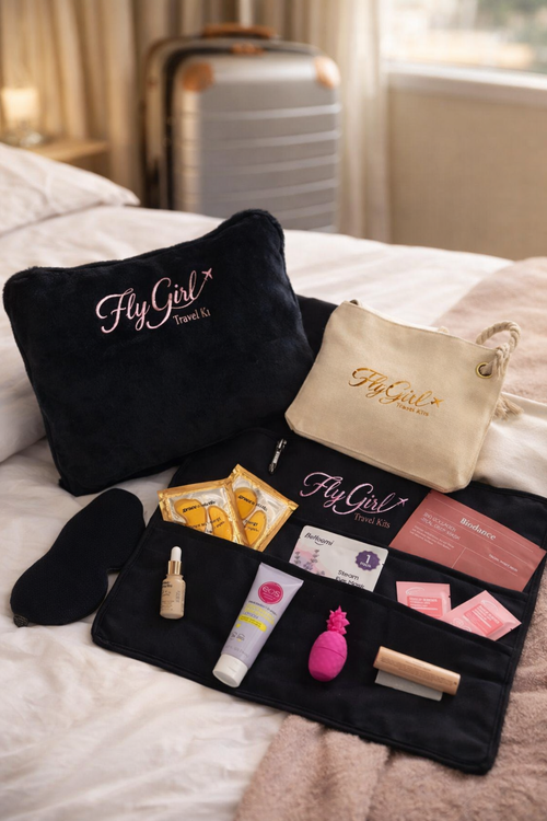 Elevated travel wellness kit with FlyGirl pouch, sleep mask, eye masks, and skincare essential